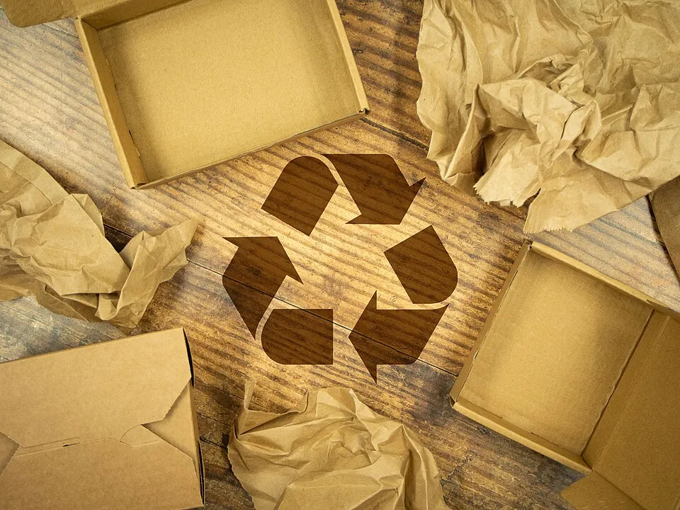 Context photograph: Recycling Symbol among Cardboard and Paper Packaging; paper context, not an identified product or supplier on this page.