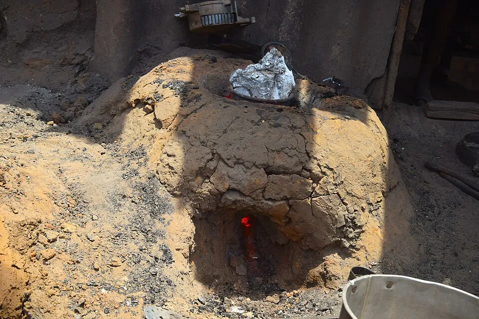 Context photograph: Production of aluminium pot (melting of aluminium) 2; metal context, not an identified product or supplier on this page.