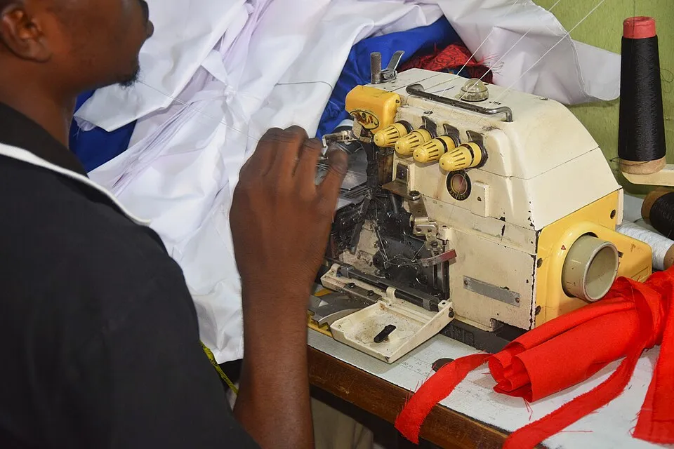 Context photograph: Sewing a new cloth with polyester fabric 1; textile context, not an identified product or supplier on this page.