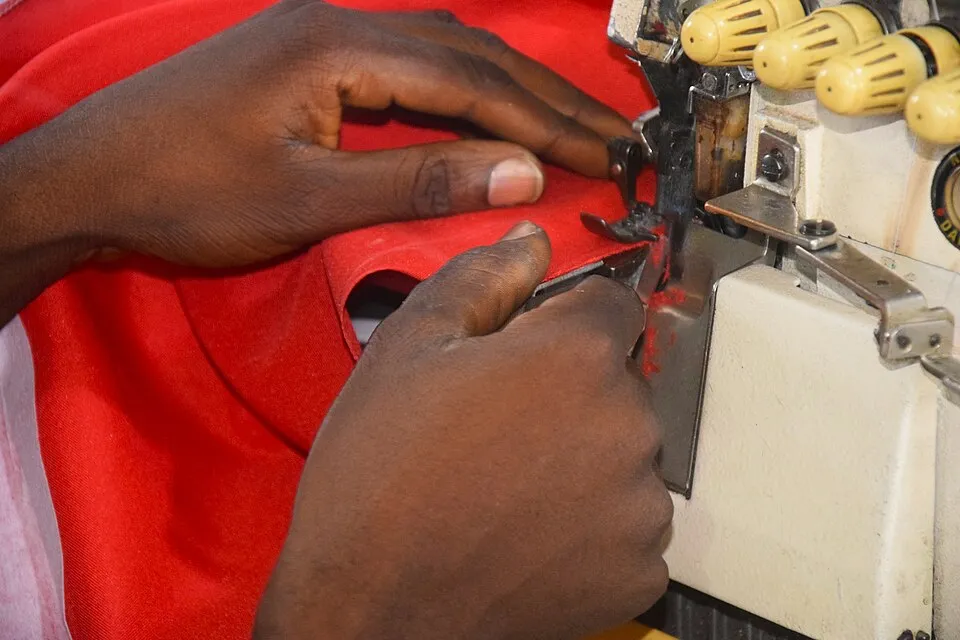 Context photograph: Sewing a new cloth with polyester fabric 9; textile context, not an identified product or supplier on this page.