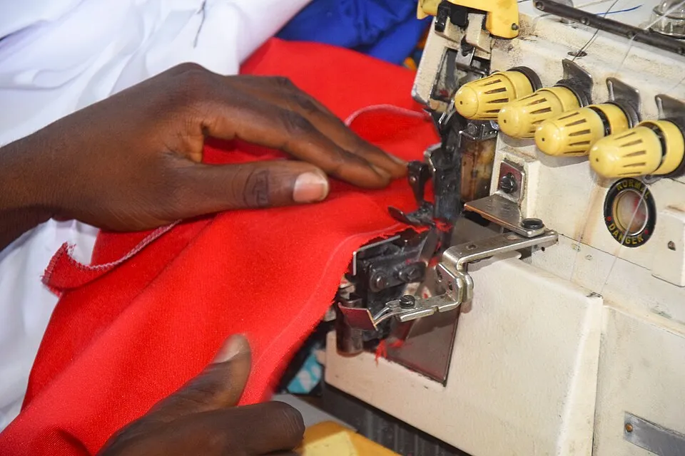 Context photograph: Sewing a new cloth with polyester fabric 8; textile context, not an identified product or supplier on this page.