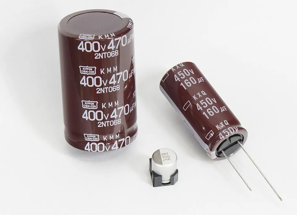 Context photograph: Nippon Chemi-Con Aluminum Electrolytic Capacitors; metal context, not an identified product or supplier on this page.