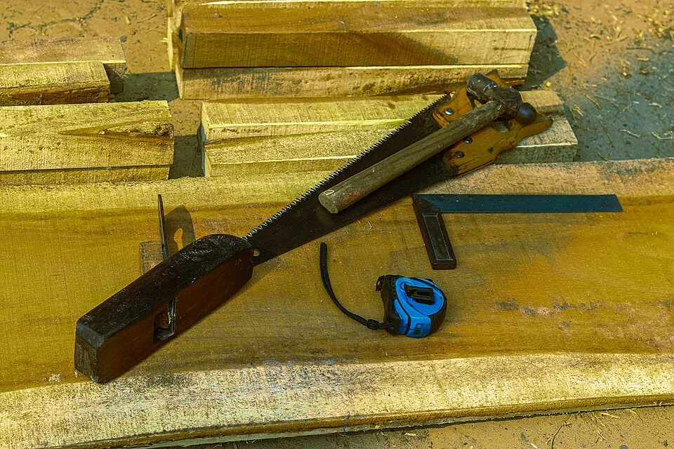 Context photograph: Woodworking hand tools on timber planks 01; timber context, not an identified product or supplier on this page.