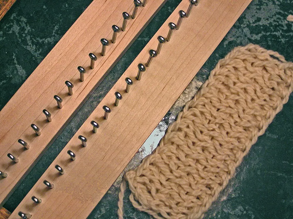 Context photograph: Knitting board; textile context, not an identified product or supplier on this page.