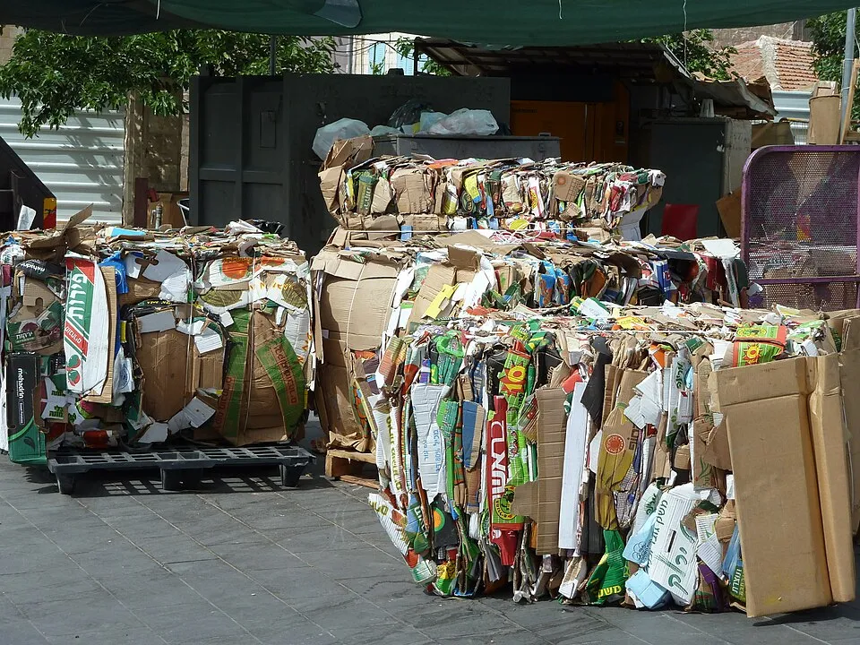 Context photograph: Jerusalem Khaim Valero square flattened cardboard boxes; paper context, not an identified product or supplier on this page.
