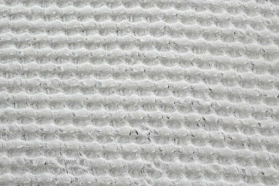 Context photograph: An example of waffle fabric; textile context, not an identified product or supplier on this page.