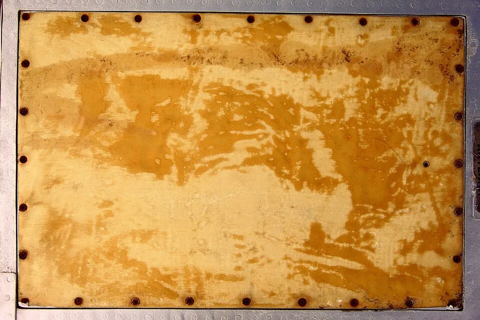 Context photograph: Stained Grunge Industrial Fabric Panel Texture (6648419467); textile context, not an identified product or supplier on this page.