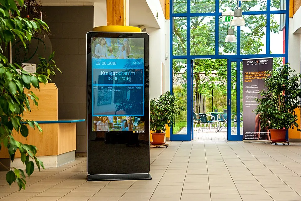 Context photograph: Digital Signage Infoterminal l Photo by Kriesten objekt design GmbH; signage context, not an identified product or supplier on this page.