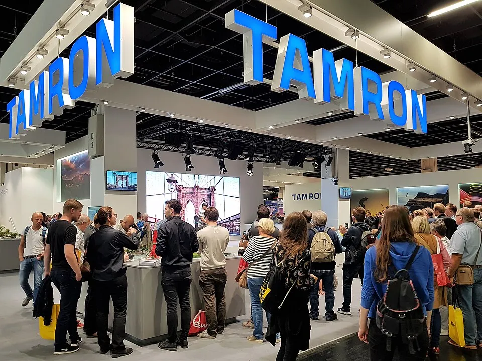 Context photograph: Photokina 2018 Messestand Tamron; events context, not an identified product or supplier on this page.
