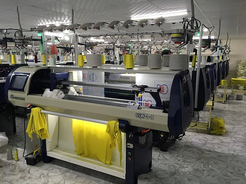 Context photograph: Computerized Flat Knitting Machine (Jacquard Machine) 04; textile context, not an identified product or supplier on this page.