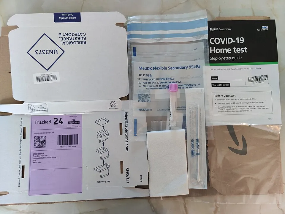 Context photograph: COVID Home Testing Kit PCR UK; science context, not an identified product or supplier on this page.